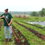 Friar Michael LASKY working at the Little Portion Farm, which grows food for the poor.